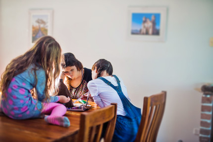 Lifestyle photography sydney- girls sitting at table.